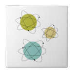 Aqua Blue and Yellow Atomic Elements Midcentury Ceramic Tile<br><div class="desc">This fabulous mid century modern ceramic tile features 3 atomic element shapes in the colours of aqua blue,  avocado green,  yellow,  and black. This makes a fabulous addition to your kitchen or bathroom.</div>