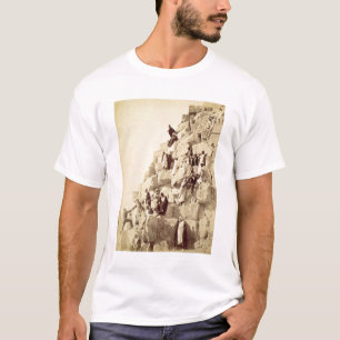 Arabs assisting tourists to climb the pyramids at T-Shirt