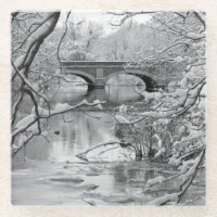 Arch Bridge over Frozen River in Winter
