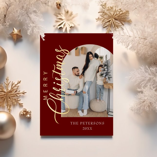 Arch Shape Burgundy Photo Christmas Greeting Foil Holiday Card (Arch Shape Burgundy Photo Christmas Greeting Foil Holiday Card on a table with golden decor.)