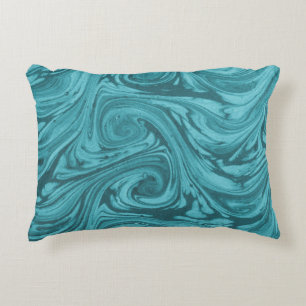 Arched and curved backdrop in tones of turquoise,  decorative cushion