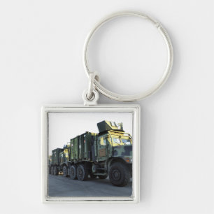 Armoured trucks sit on the pier at Morehead City Key Ring