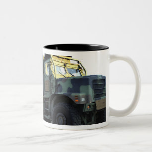 Armoured trucks sit on the pier at Morehead City Two-Tone Coffee Mug