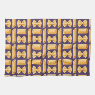 Array of various pasta shapes on a purple tea towel