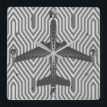 Art Deco Aeroplane, Graphite and Silver Grey Square Wall Clock<br><div class="desc">Clock as an Art Deco inspired concept of a futuristic plane,  in a striped,  silky gradient of silver to deep graphite grey / grey,  against  a light and deep silver grey,  Deco background</div>