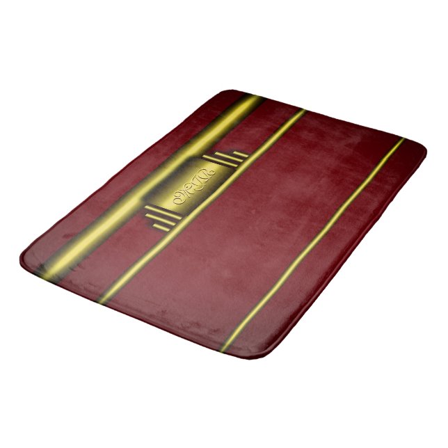 Art deco monogram on luxury gold and maroon bath mat (Angled)