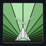Art deco sun in green square wall clock<br><div class="desc">A classic art deco style sun pattern in green. 

An iconic pattern of the sun rising from behind a stylised art deco shaped building. A simple yet elegant design,  true to the era.</div>