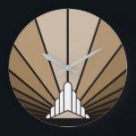 Art deco sun in tan Wall Clock<br><div class="desc">A classic art deco style sun pattern in tan. 

An iconic pattern of the sun rising from behind a stylised art deco shaped building. A simple yet elegant design,  true to the era.</div>