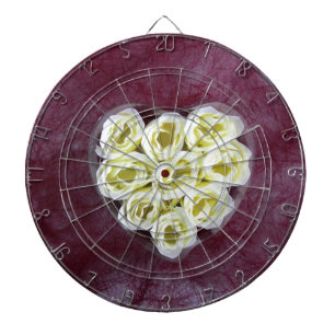 Artificial white cream flower on purple background dartboard