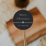Ash | Modern Bow Simple Minimal Christmas Classic Round Sticker<br><div class="desc">Finish your holiday mailings and gifts with these sweet and simple Christmas stickers,  customisable with your preferred holiday greeting and family signature (shown with "Merry Christmas") on a soft ash black background. A petite bow running through the centre completes this elegant minimalist holiday design.</div>