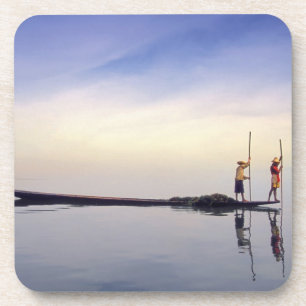 Asia, Burma, (Myanmar) Fishing boat reflected on Coaster
