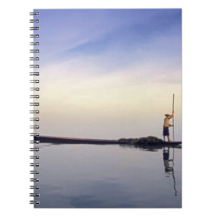 Asia, Burma, (Myanmar) Fishing boat reflected on Notebook