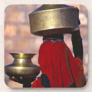 Asia, India, Rajasthan. A local woman in a red Coaster