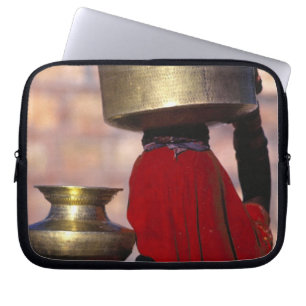 Asia, India, Rajasthan. A local woman in a red Laptop Sleeve