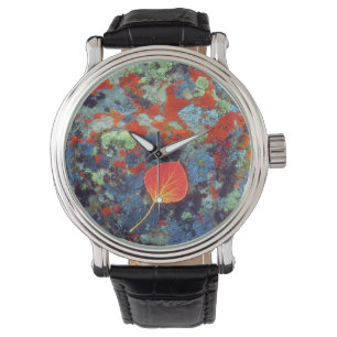 Aspen leaf on a lichen covered rock watch