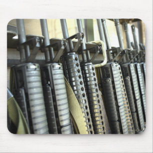 Assault rifles stand ready on the weapons rack mouse pad