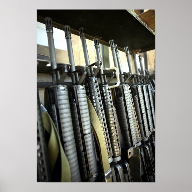 Assault rifles stand ready on the weapons rack poster (Front)