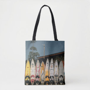 Assorted surfing boards stands on open field in th tote bag