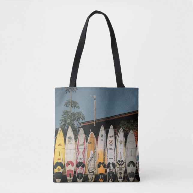 Assorted surfing boards stands on open field in th tote bag (Front)