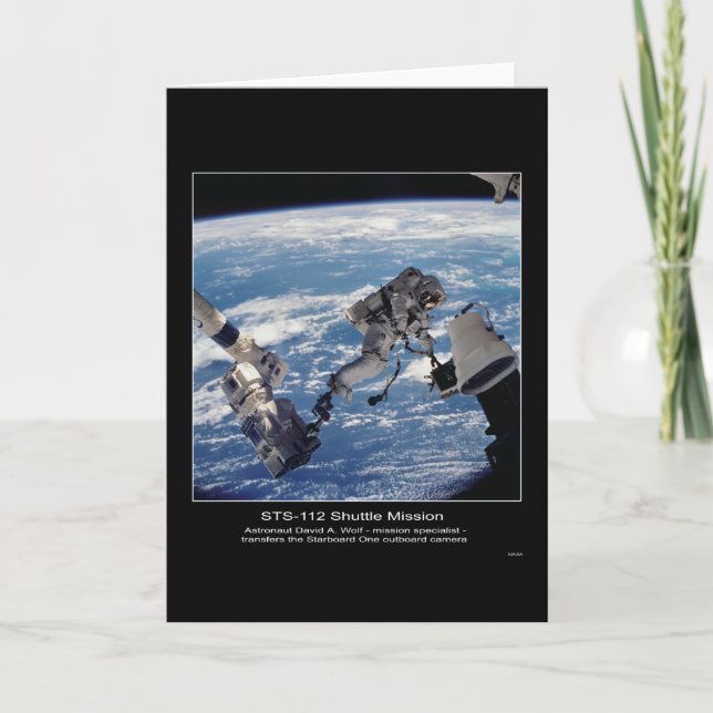 Astronaut David A. Wolf  transfers the Starboard O Card (Front)