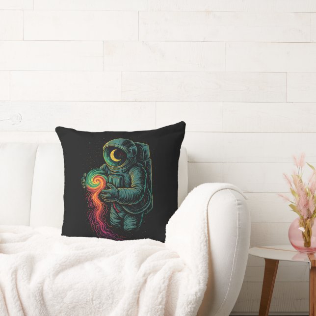 Astronaut Holding a Cosmic Spiral Cushion (Couch)