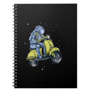 Astronaut riding scooter in space notebook