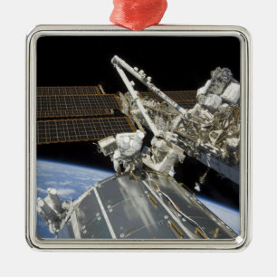 Astronauts perform a series of tasks metal ornament