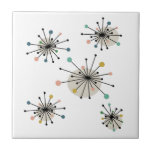 Atomic Era Colourful Starburst Mid Century Retro Ceramic Tile<br><div class="desc">This mid century modern decorative tile features shooting starbursts in the colours of turquoise,  orange,  tan,  avocado,  blue,  black and brown. This will make a fantastic addition to your tiling project or home decor.</div>