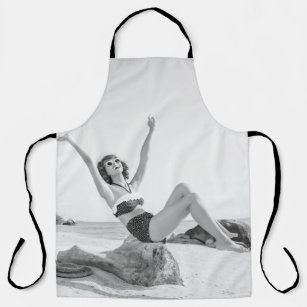 Attractive young woman in bikini on the beachvinta apron