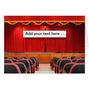 Auditorium with Red Curtains and Banner