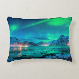 Aurora borealis over the sea coast, snowy mountain decorative cushion