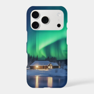 Aurora borealis over winter cabin