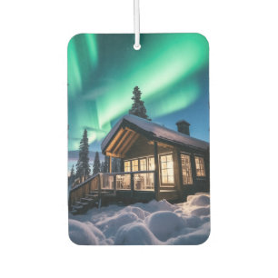 Aurora borealis over winter cabin car air freshener