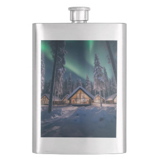 Aurora borealis over winter cabin hip flask