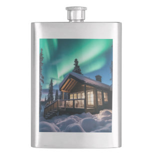 Aurora borealis over winter cabin hip flask