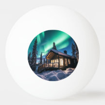Aurora borealis over winter cabin