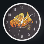 Australia Aboriginal Art Clock<br><div class="desc">This beautiful wall clock features Australian Aboriginal Art. The main image is the outline of the country Australia. Within this,  there is pictures of a kangaroo,  a grass tree,  an Aborignal Australian playing the didgeridoo and the iconic dot painting style in the colours black,  white,  yellow and orange.</div>