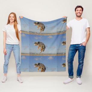 australian shepherd blue merle at beach jumping fleece blanket