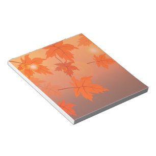 Autumn design with maple leaves and bokeh effect notepad