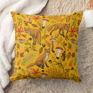 Autumn foxes on orange cushion