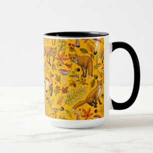 Autumn foxes on orange mug
