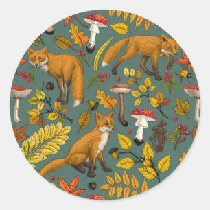 Autumn foxes on pine green classic round sticker