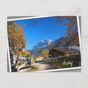 Autumn in a village in the Dolomites in Italy Postcard