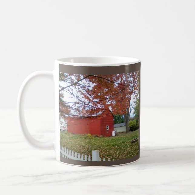Autumn leaves and a sweet red barn on a mug. coffee mug (Left)