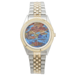 Autumn leaves floating on the water, blue & brown watch