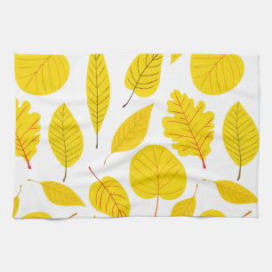 Autumn leaves in yellow tea towel