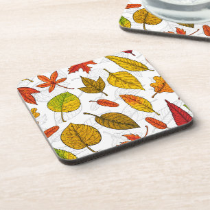 Autumn leaves on white coaster