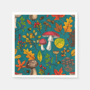 Autumn mushrooms, leaves, nuts and berries on blue napkin