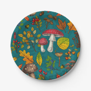 Autumn mushrooms, leaves, nuts and berries on blue paper plate