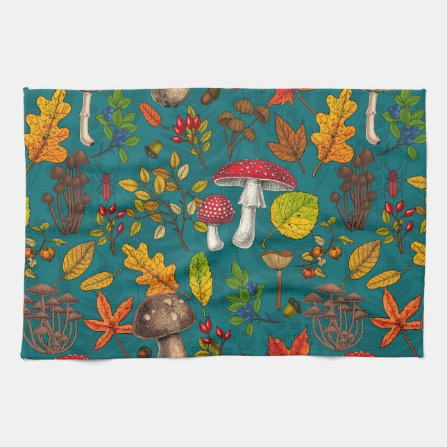 Autumn mushrooms, leaves, nuts and berries on blue tea towel (Horizontal)